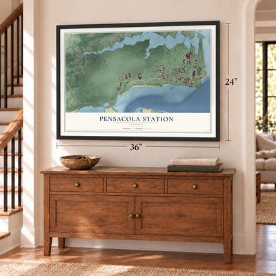 Pensacola Station, Florida map, 24 x 36 inch print in a black frame above a dresser by a staircase
