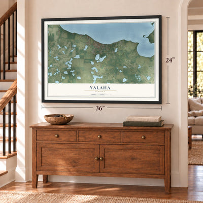 Yalaha, Florida map, 24 x 36 inch print in a black frame above a dresser by a staircase