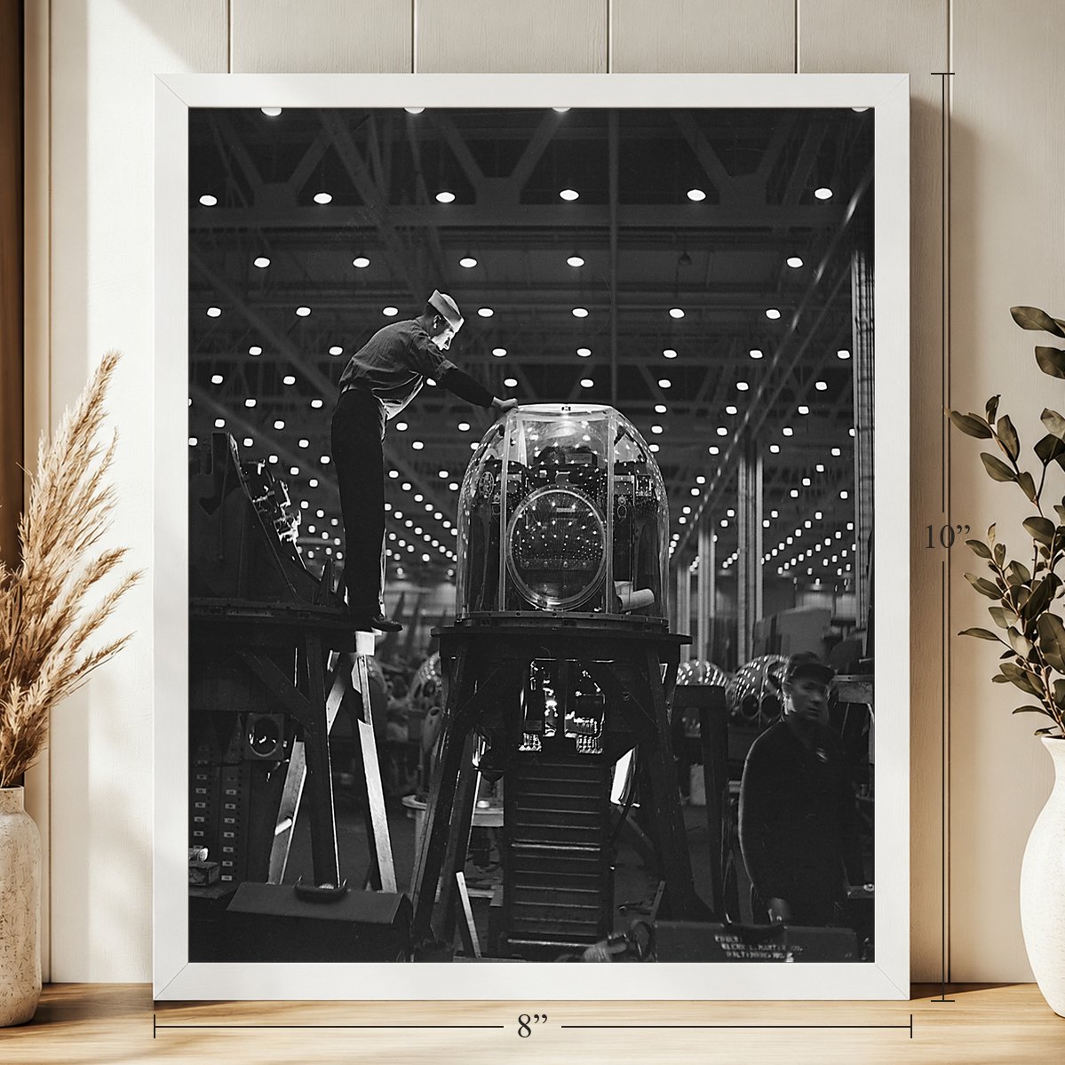Gun Turret at the Martin Plant, Baltimore, 1943, 8 x 10 inch vintage photo print in a white frame on a shelf