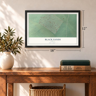 Black Sands, Hawaii map, 12 x 18 inch print in a black frame in an entryway