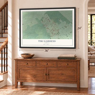 Tiki Gardens, Hawaii map, 24 x 36 inch print in a black frame above a dresser by a staircase