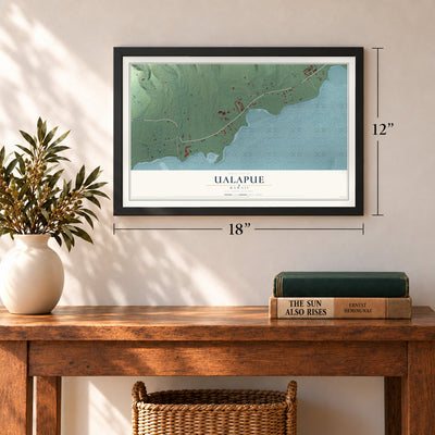 Ualapue, Hawaii map, 12 x 18 inch print in a black frame in an entryway