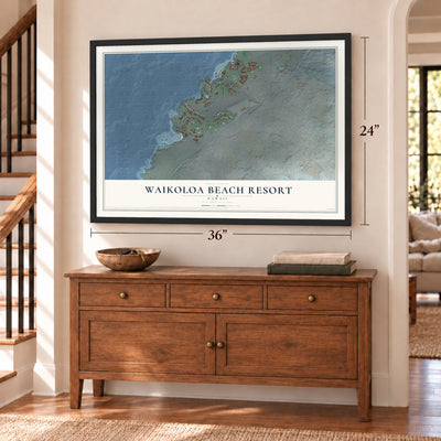 Waikoloa Beach Resort, Hawaii map, 24 x 36 inch print in a black frame above a dresser by a staircase