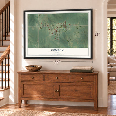 Conroy, Iowa map, 24 x 36 inch print in a black frame above a dresser by a staircase