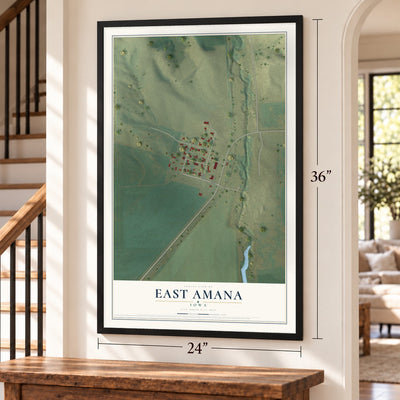 East Amana, Iowa map, 24 x 36 inch print in a black frame by a staircase