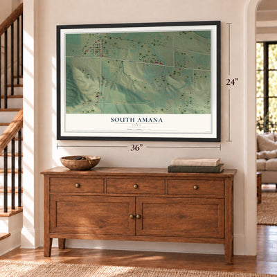South Amana, Iowa map, 24 x 36 inch print in a black frame above a dresser by a staircase