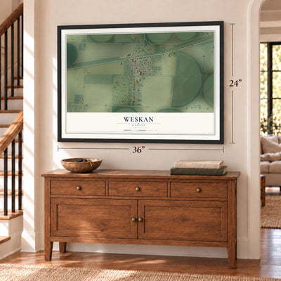 Weskan, Kansas map, 24 x 36 inch print in a black frame above a dresser by a staircase