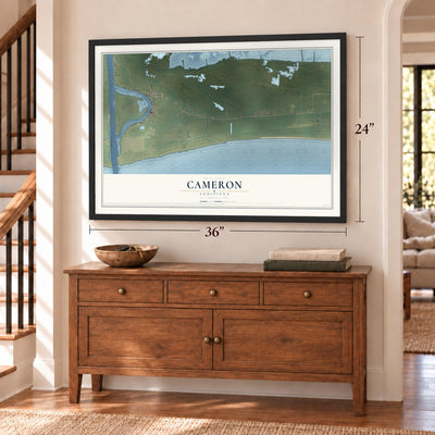Cameron, Louisiana map, 24 x 36 inch print in a black frame above a dresser by a staircase