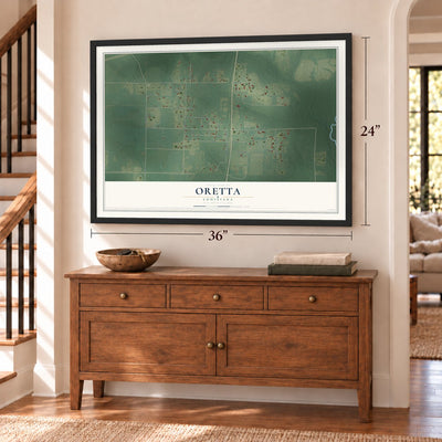 Oretta, Louisiana map, 24 x 36 inch print in a black frame above a dresser by a staircase