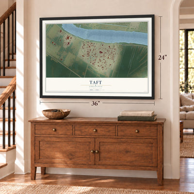 Taft, Louisiana map, 24 x 36 inch print in a black frame above a dresser by a staircase