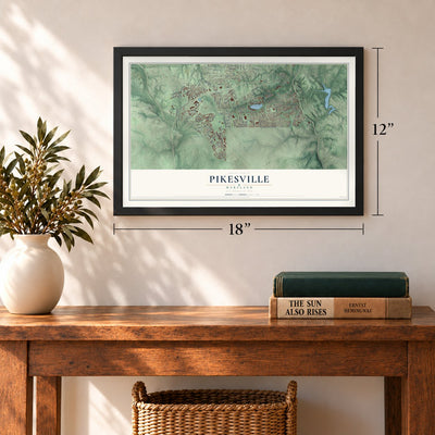 Pikesville, Maryland map, 12 x 18 inch print in a black frame in an entryway