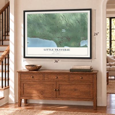 Little Traverse, Michigan map, 24 x 36 inch print in a black frame above a dresser by a staircase