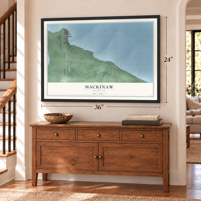 Mackinaw, Michigan map, 24 x 36 inch print in a black frame above a dresser by a staircase