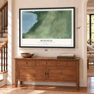 McKinley, Huron County, Michigan map, 24 x 36 inch print in a black frame above a dresser by a staircase