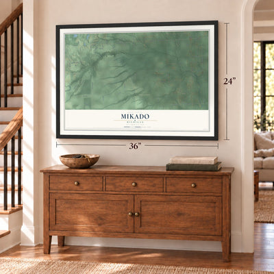 Mikado, Michigan map, 24 x 36 inch print in a black frame above a dresser by a staircase