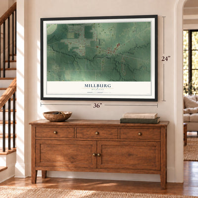 Millburg, Michigan map, 24 x 36 inch print in a black frame above a dresser by a staircase