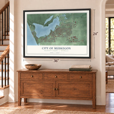Muskegon, Michigan map, 24 x 36 inch print in a black frame above a dresser by a staircase