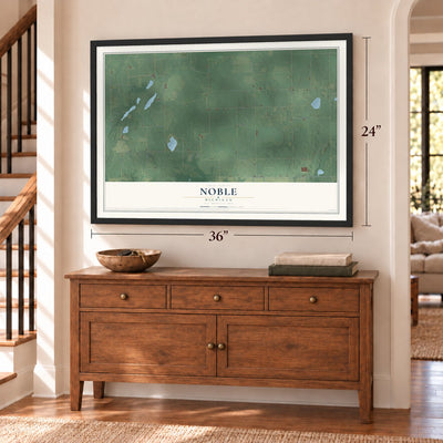 Noble, Michigan map, 24 x 36 inch print in a black frame above a dresser by a staircase
