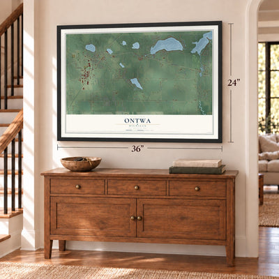 Ontwa, Michigan map, 24 x 36 inch print in a black frame above a dresser by a staircase