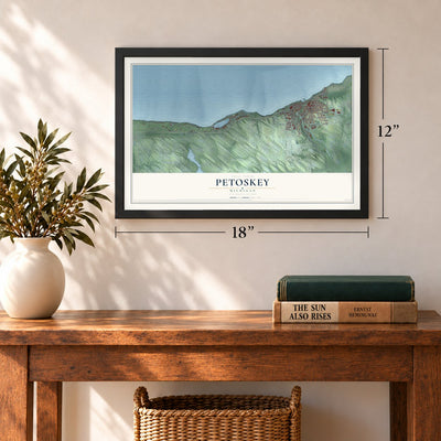 Petoskey, Michigan map, 12 x 18 inch print in a black frame in an entryway