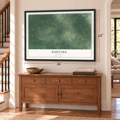 Rudyard, Michigan map, 24 x 36 inch print in a black frame above a dresser by a staircase