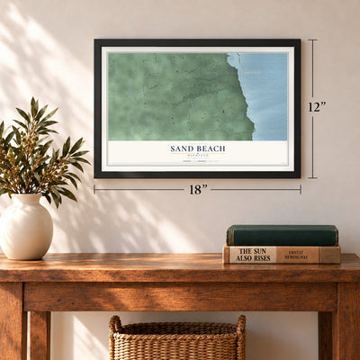 Sand Beach, Michigan map, 12 x 18 inch print in a black frame in an entryway