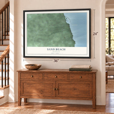 Sand Beach, Michigan map, 24 x 36 inch print in a black frame above a dresser by a staircase