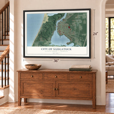 Saugatuck, Michigan map, 24 x 36 inch print in a black frame above a dresser by a staircase