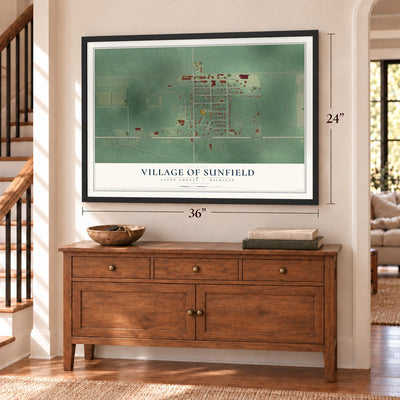 Sunfield, Michigan map, 24 x 36 inch print in a black frame above a dresser by a staircase