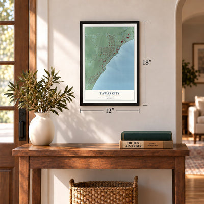 Tawas City, Michigan map, 12 x 18 inch print in a black frame in an entryway
