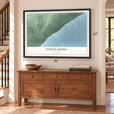 North Shore, Minnesota map, 24 x 36 inch print in a black frame above a dresser by a staircase