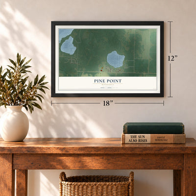Pine Point, Minnesota map, 12 x 18 inch print in a black frame in an entryway