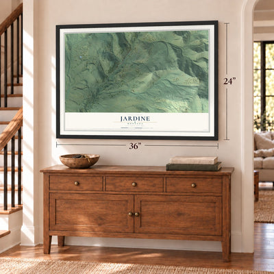 Jardine, Montana map, 24 x 36 inch print in a black frame above a dresser by a staircase