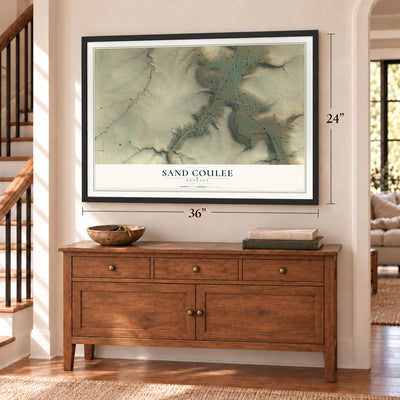 Sand Coulee, Montana map, 24 x 36 inch print in a black frame above a dresser by a staircase