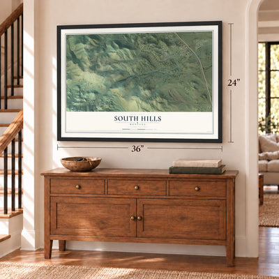 South Hills, Montana map, 24 x 36 inch print in a black frame above a dresser by a staircase