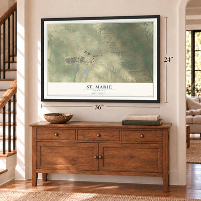 St. Marie, Montana map, 24 x 36 inch print in a black frame above a dresser by a staircase