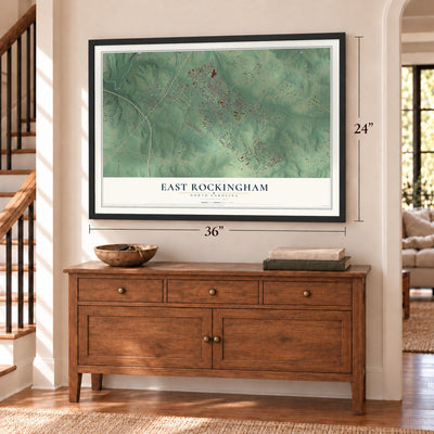 East Rockingham, North Carolina map, 24 x 36 inch print in a black frame above a dresser by a staircase