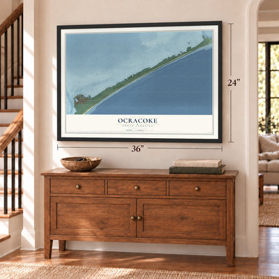 Ocracoke, North Carolina map, 24 x 36 inch print in a black frame above a dresser by a staircase