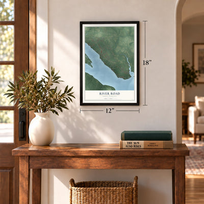 River Road, North Carolina map, 12 x 18 inch print in a black frame in an entryway