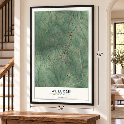 Welcome, North Carolina map, 24 x 36 inch print in a black frame by a staircase