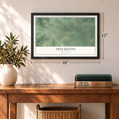 Twin Buttes, North Dakota map, 12 x 18 inch print in a black frame in an entryway