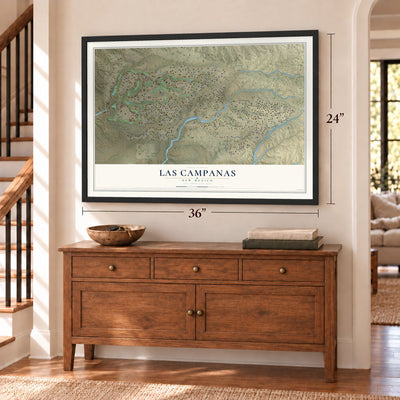 Las Campanas, New Mexico map, 24 x 36 inch print in a black frame above a dresser by a staircase