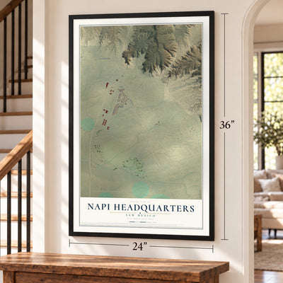 Napi Headquarters, New Mexico map, 24 x 36 inch print in a black frame by a staircase