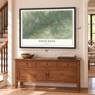 South River, New Mexico map, 24 x 36 inch print in a black frame above a dresser by a staircase