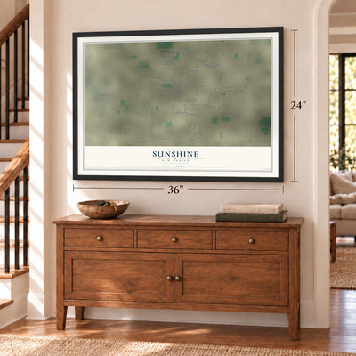 Sunshine, New Mexico map, 24 x 36 inch print in a black frame above a dresser by a staircase