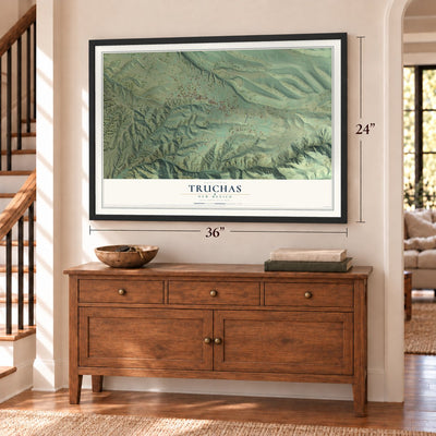Truchas, New Mexico map, 24 x 36 inch print in a black frame above a dresser by a staircase