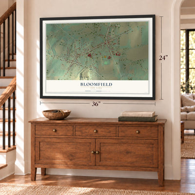 Bloomfield, New York map, 24 x 36 inch print in a black frame above a dresser by a staircase