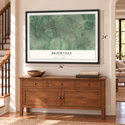 Brookville, New York map, 24 x 36 inch print in a black frame above a dresser by a staircase