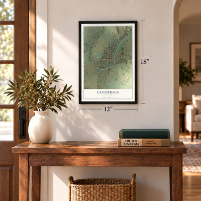 Canaseraga, New York map, 12 x 18 inch print in a black frame in an entryway