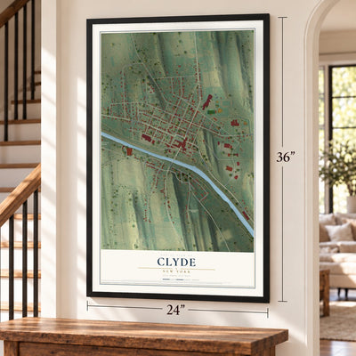 Clyde, New York map, 24 x 36 inch print in a black frame by a staircase